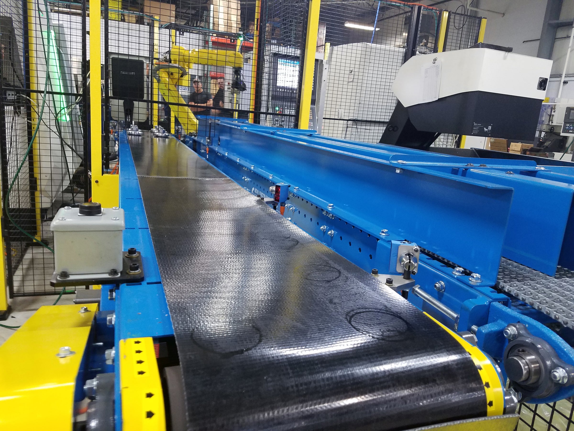 robot fed conveyor